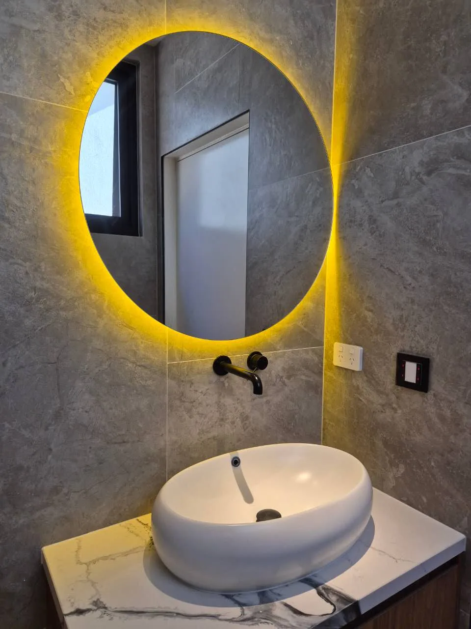 Coated bathroom basin and mirror